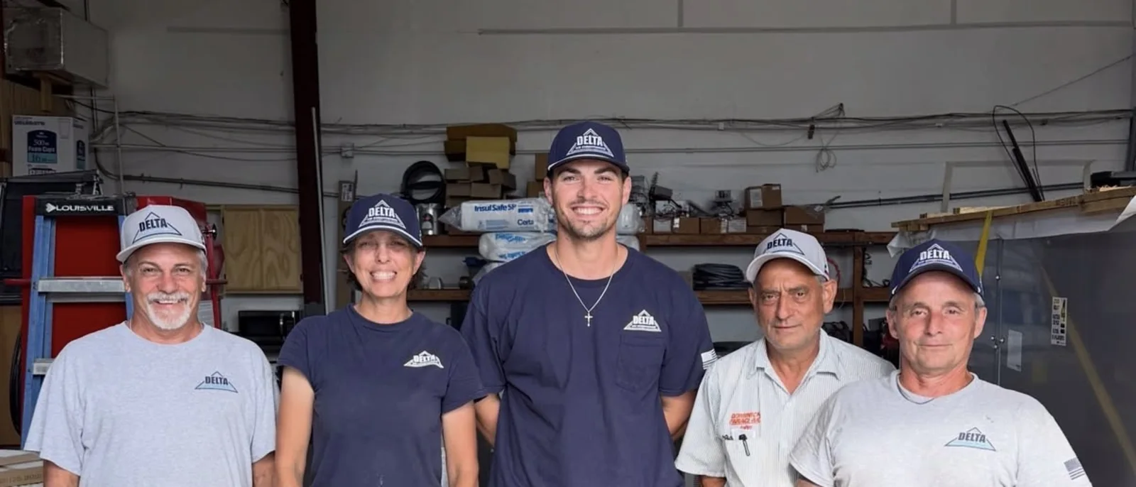 The Delta Air Conditioning crew wearing their custom embroidered Reel 48 caps in the shop