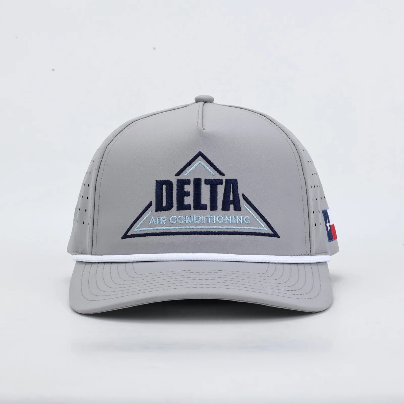 Grey Delta Air Conditioning performance rope cap with the embroidered Delta logo and a Texas flag on the side