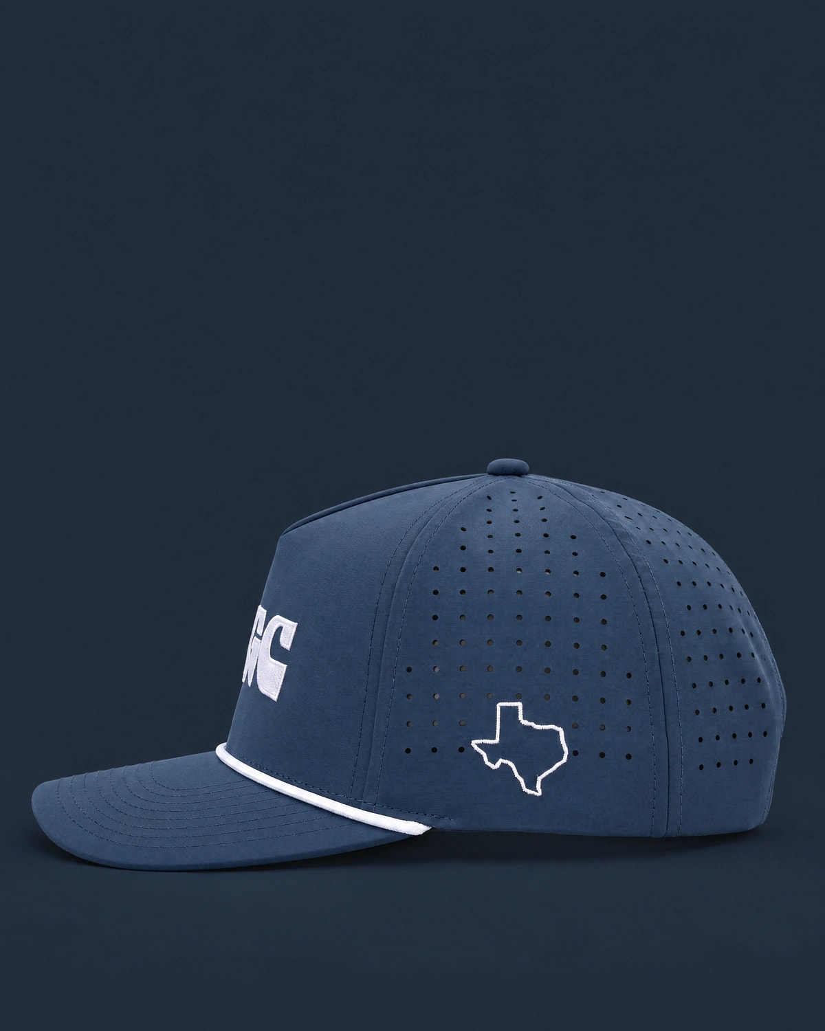 Navy perforated rope cap with the MGC wordmark on the front and a Texas outline embroidered on the side