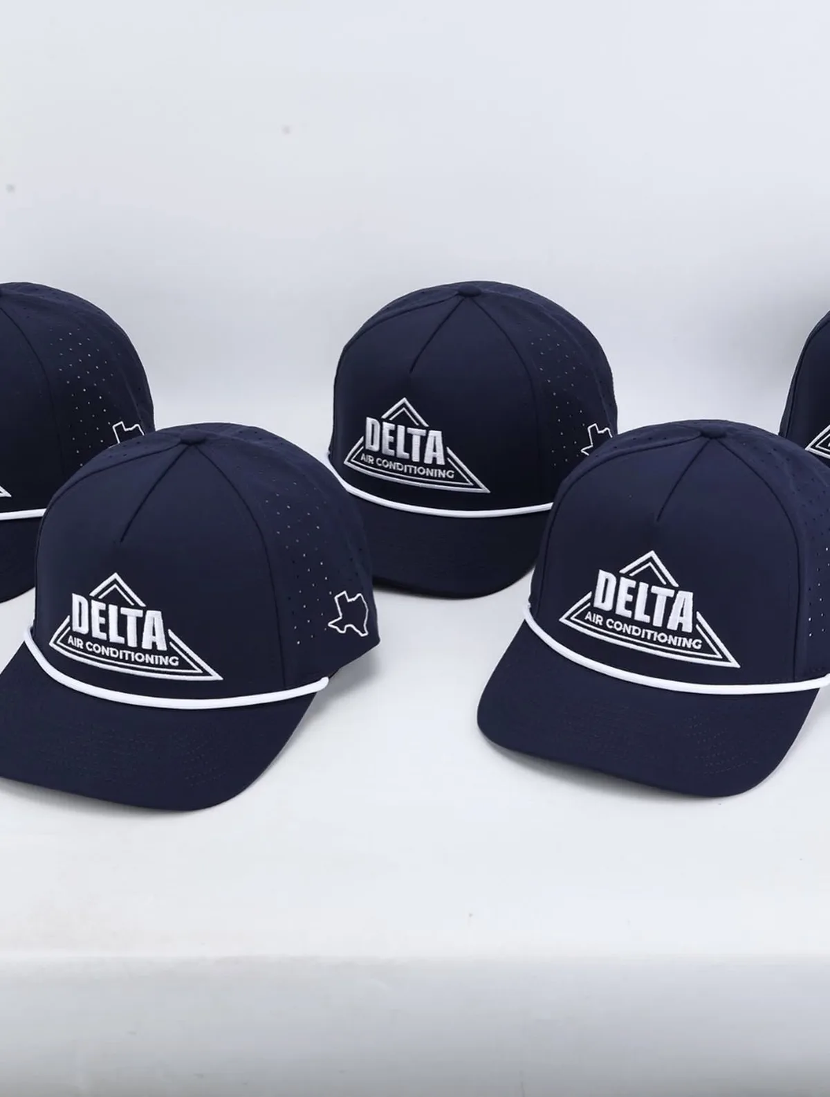 Navy Delta Air Conditioning caps with embroidered logo
