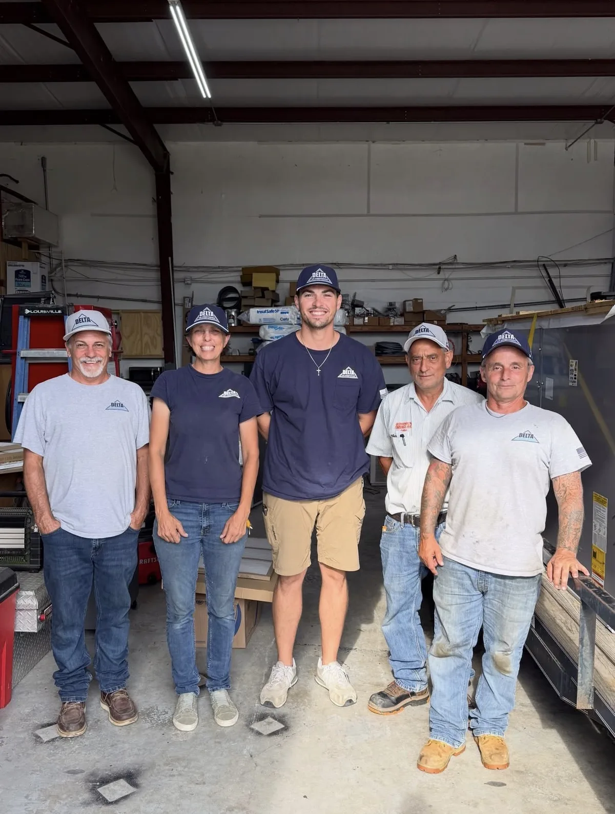 The Delta Air Conditioning crew wearing their custom caps in the shop